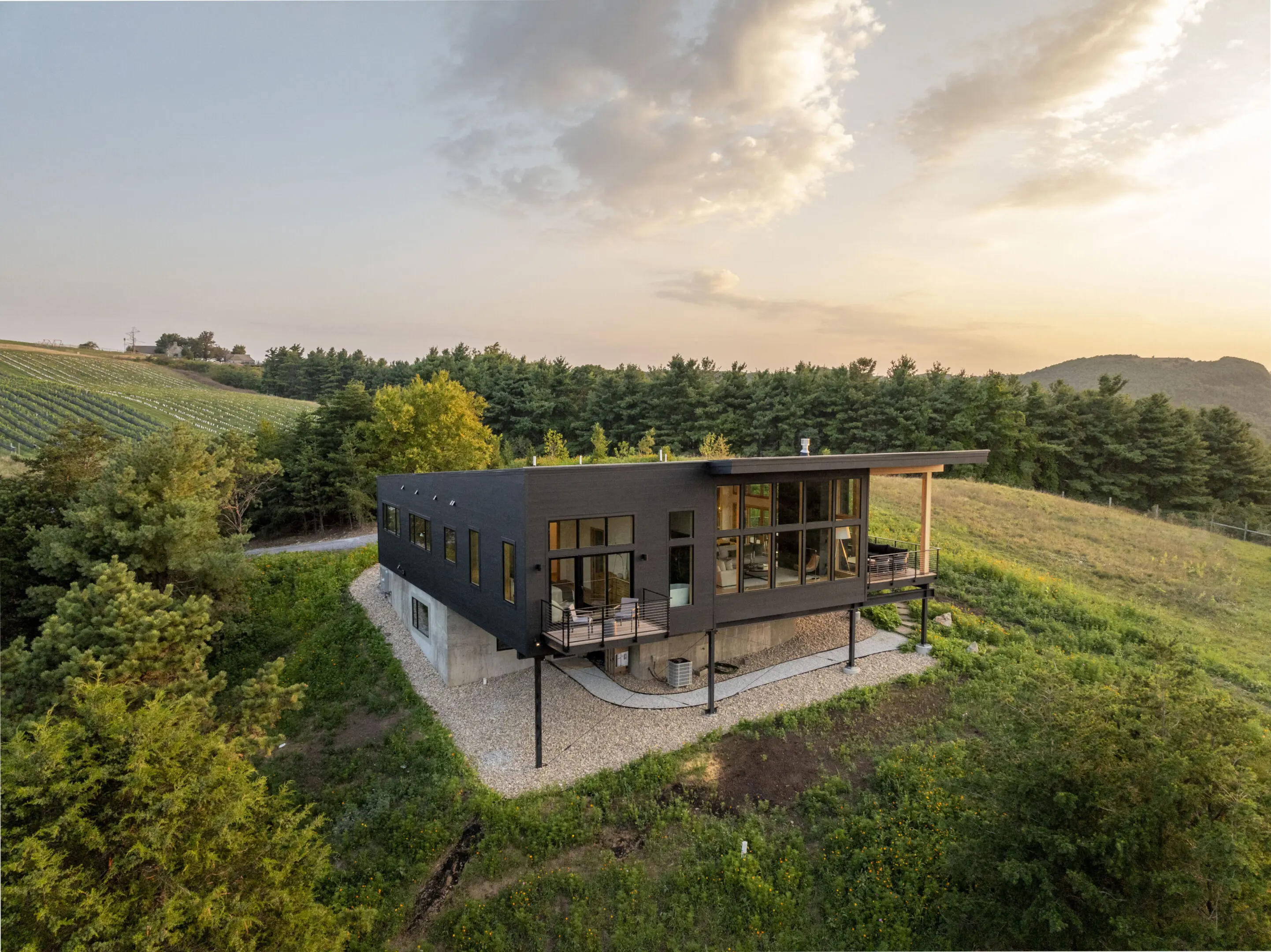 A house with a deck on top of it