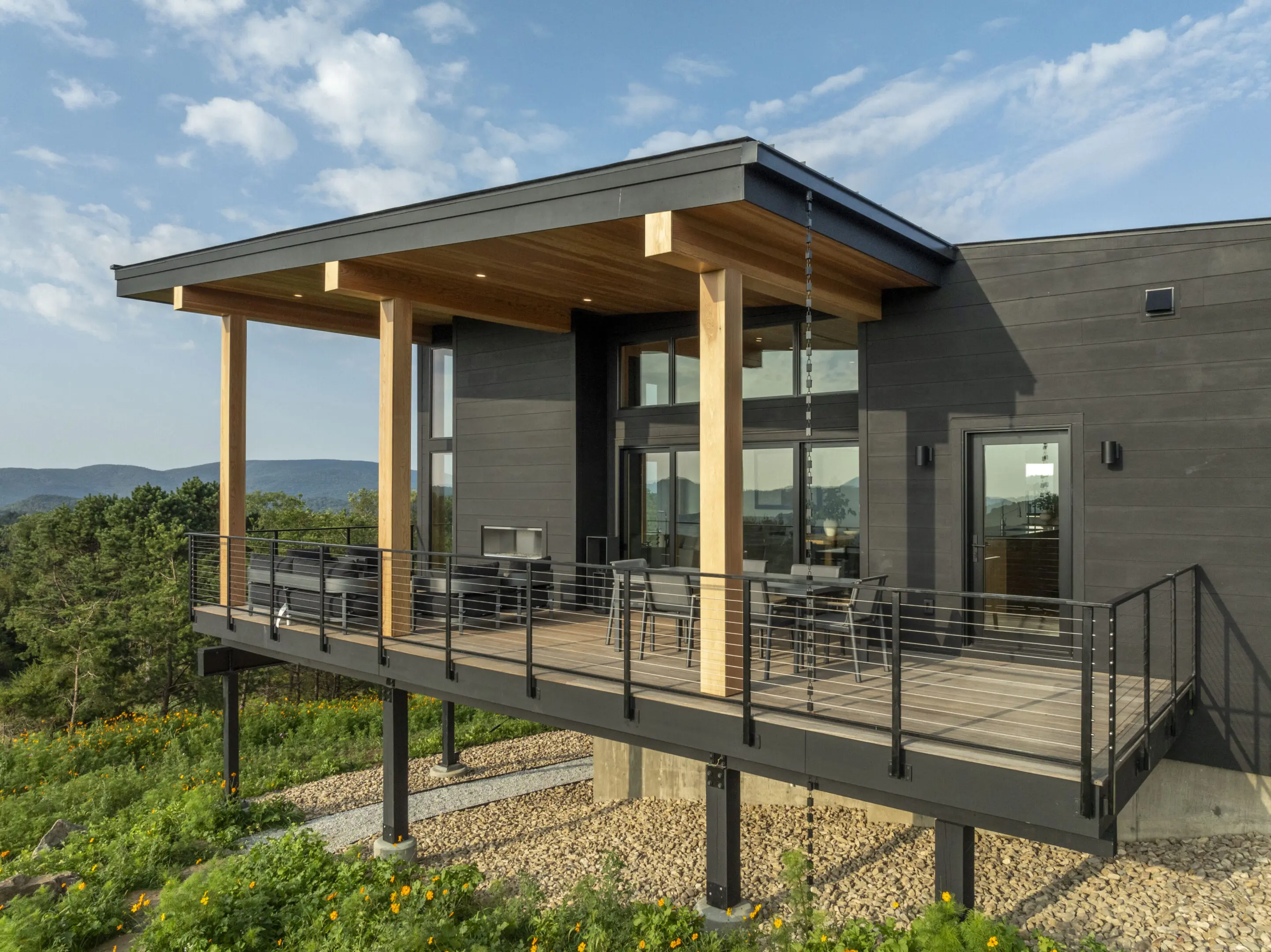 A large deck with chairs and tables on it