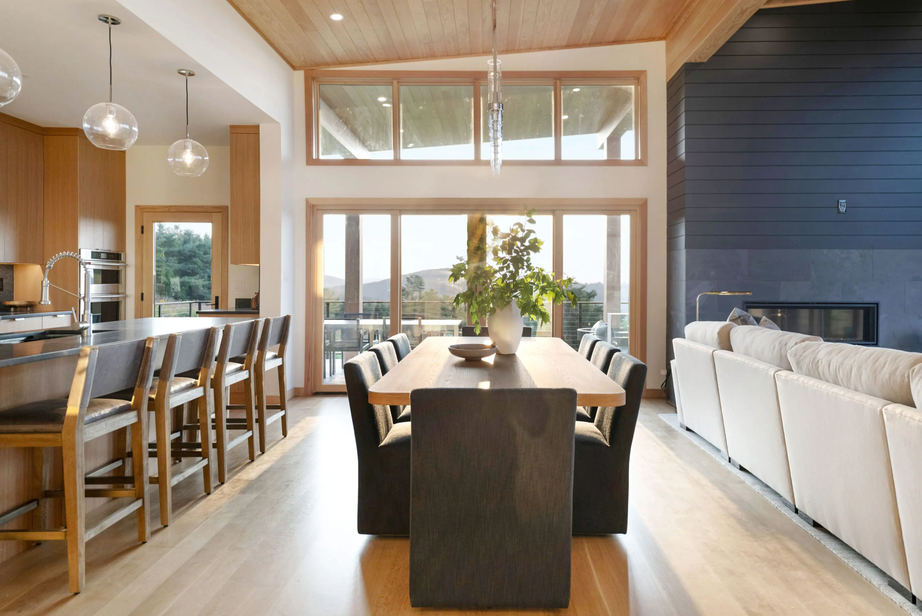 A large dining room table with chairs around it.