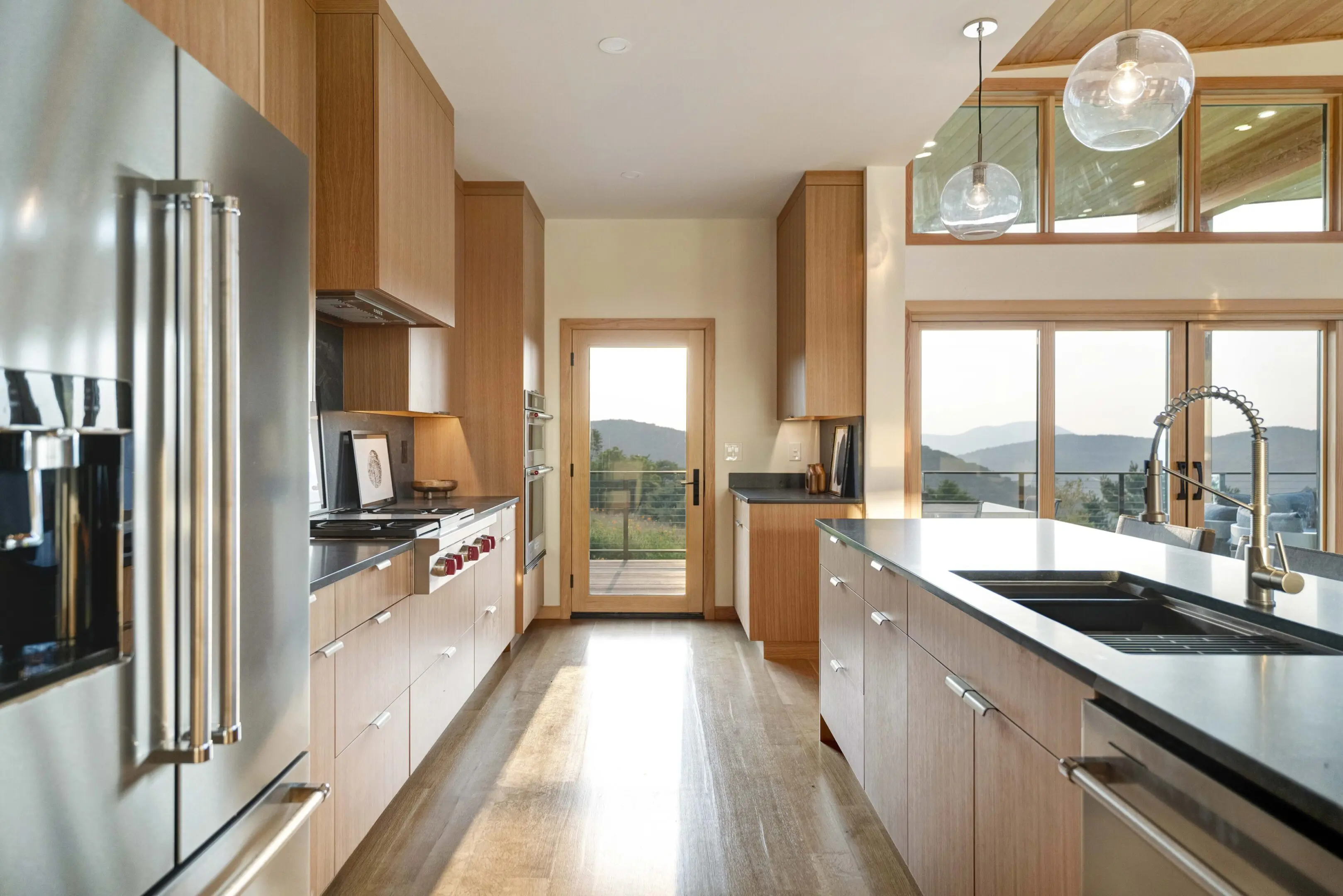 A kitchen with wooden cabinets and white counters.