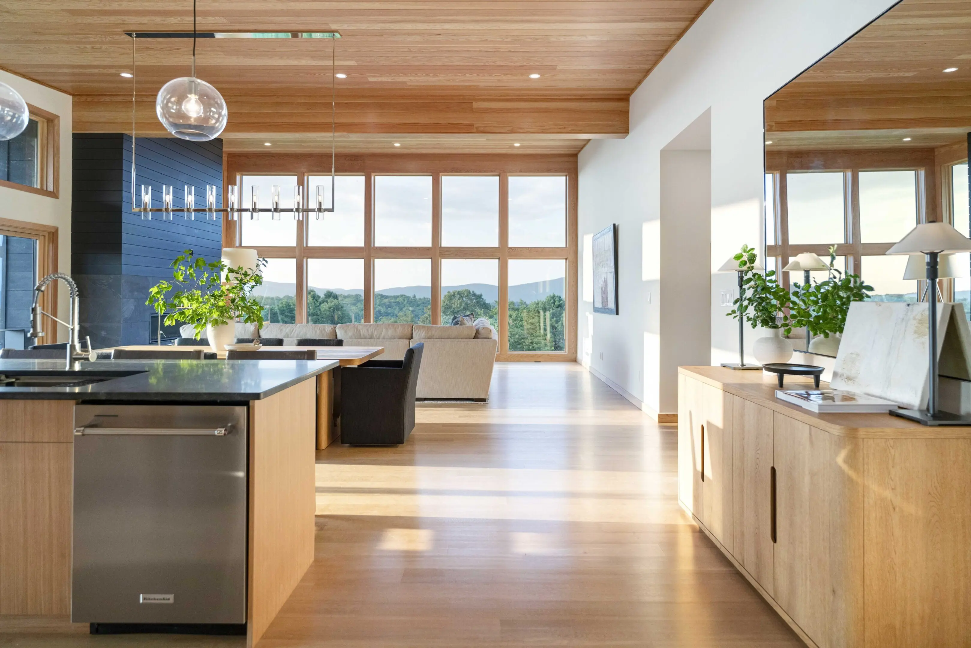 A large open kitchen with lots of windows.