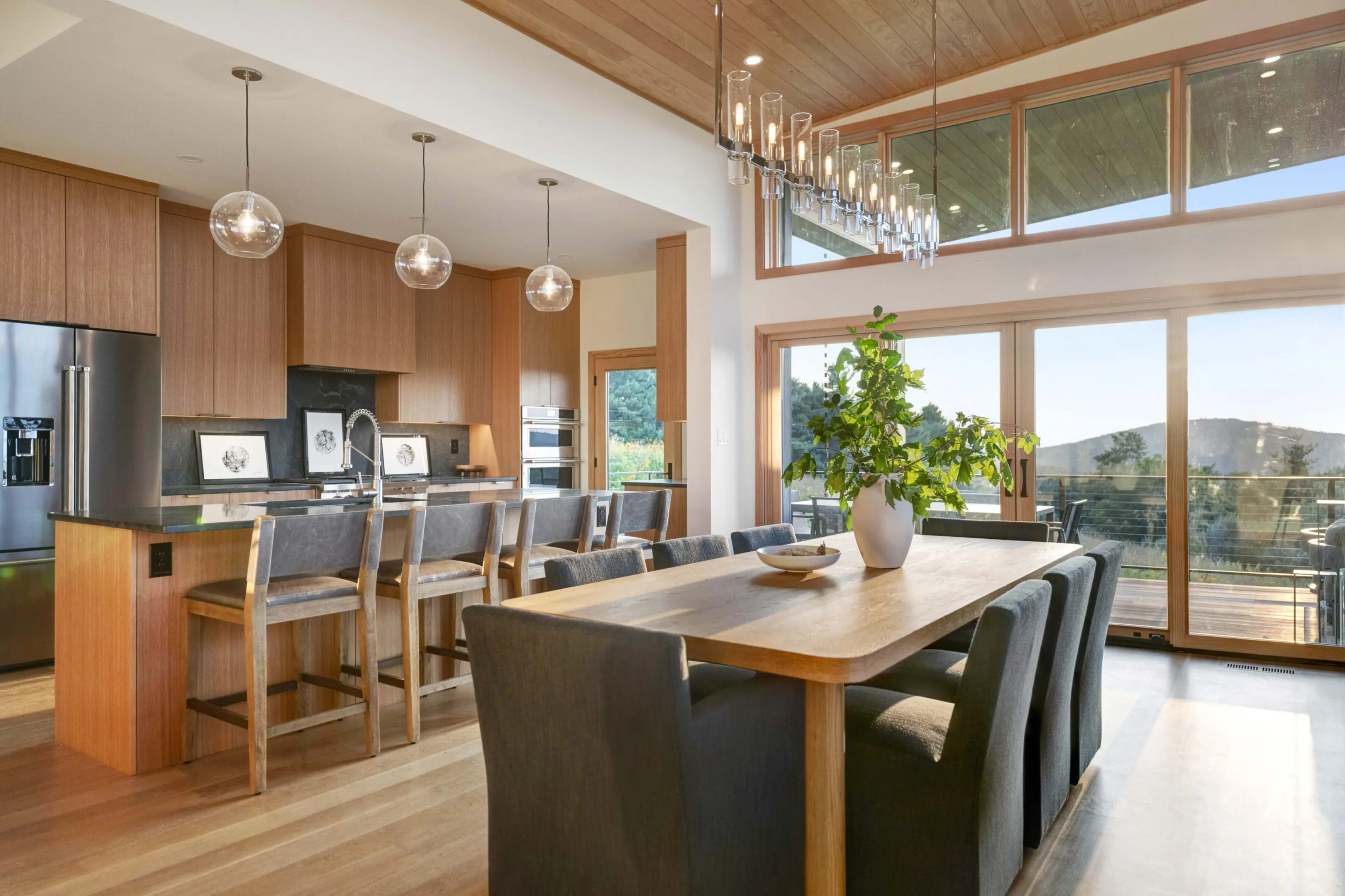 A large open kitchen with lots of windows.