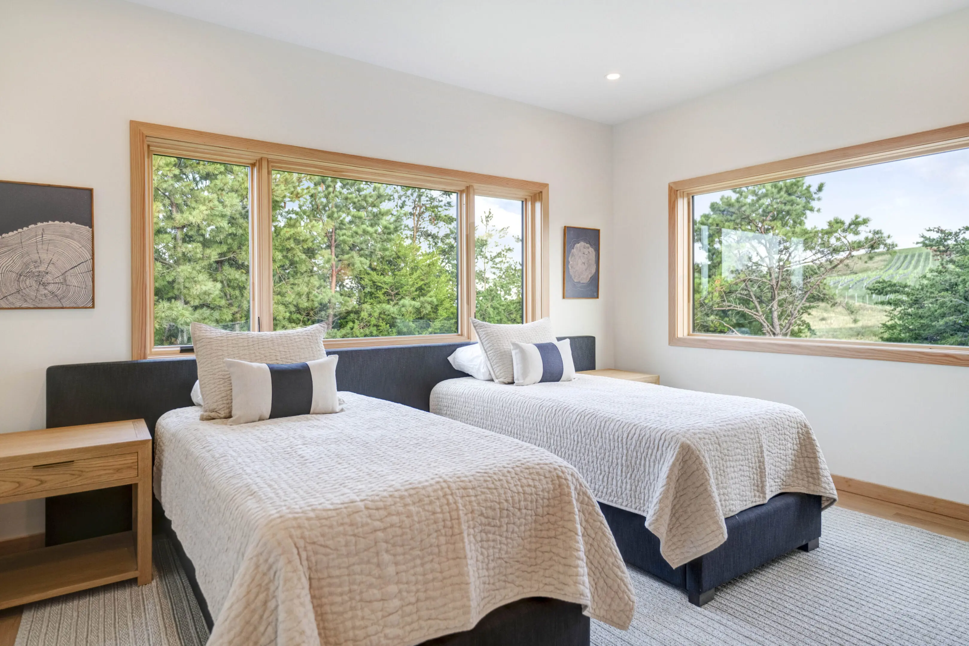 A bedroom with two beds and a couch in it