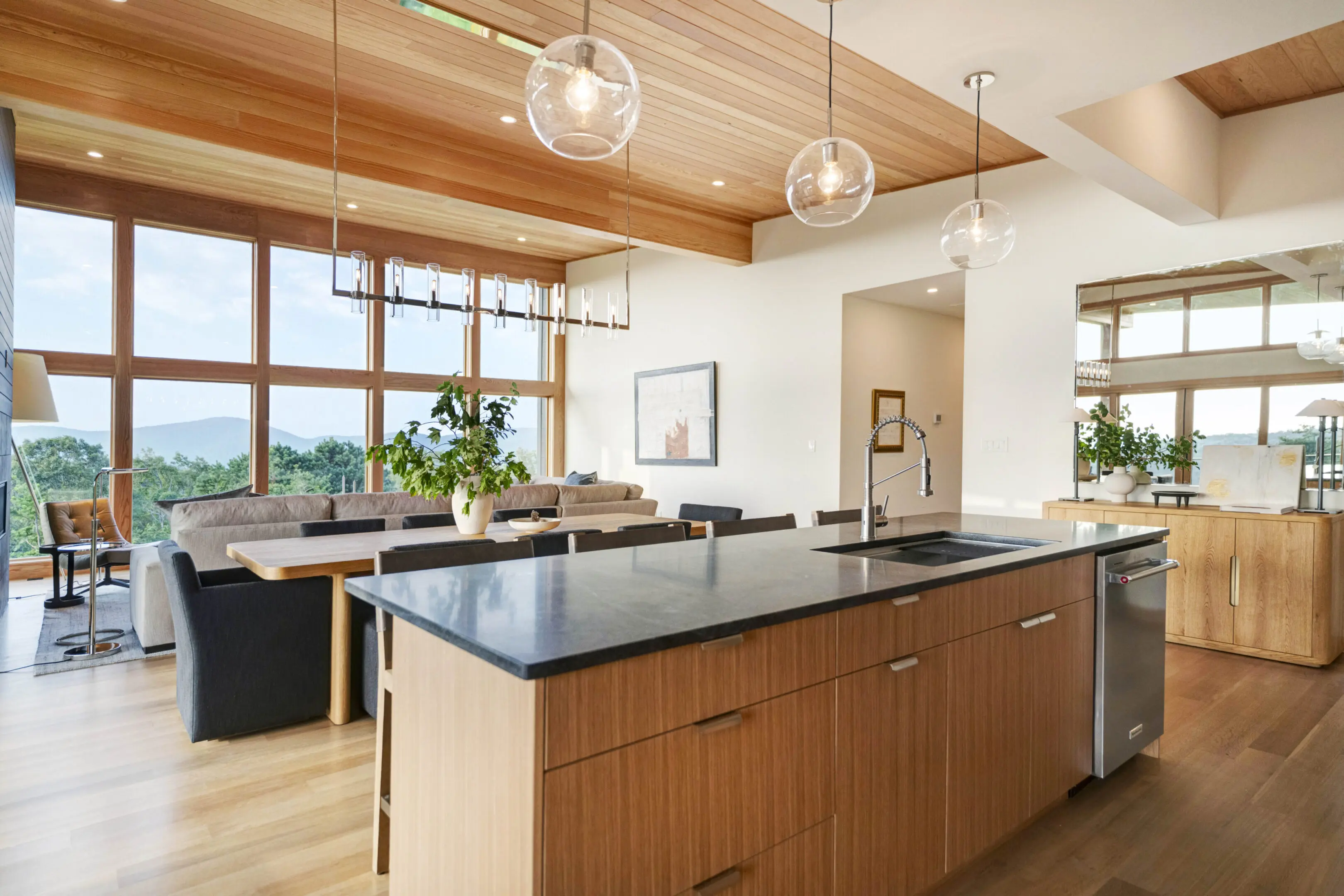 A kitchen with a large island and wooden cabinets.