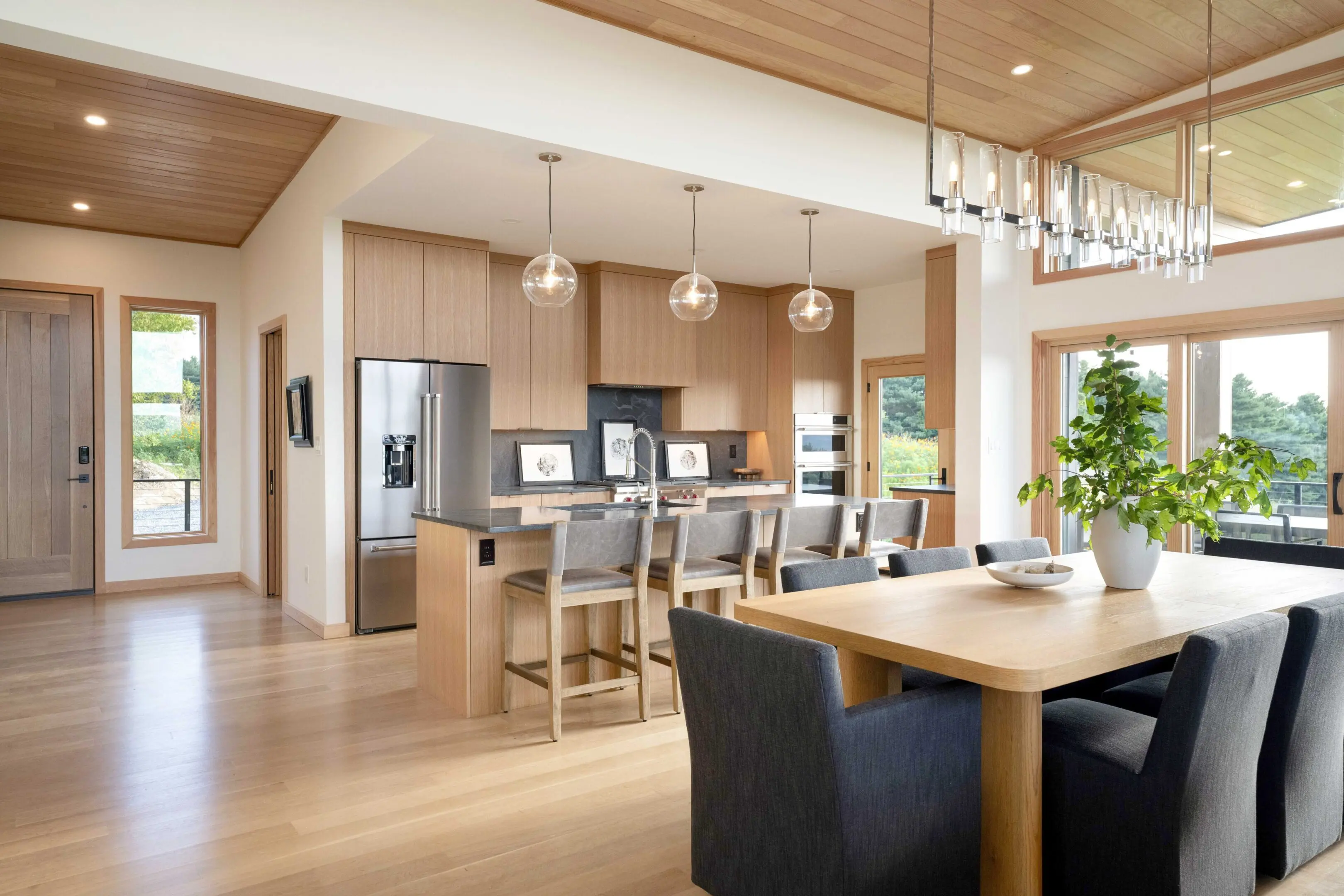 A kitchen with wooden floors and cabinets