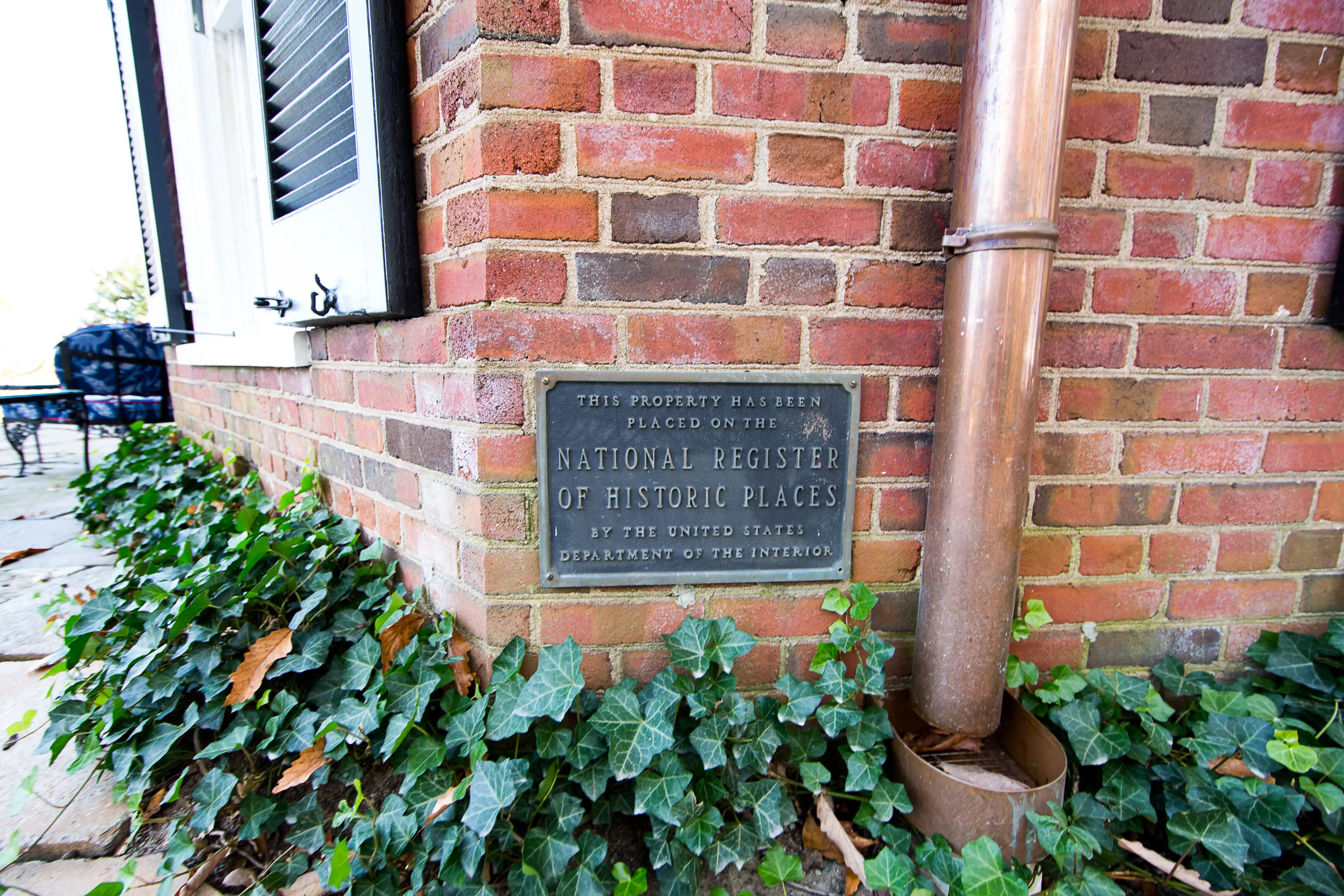 A plaque on the side of a building.