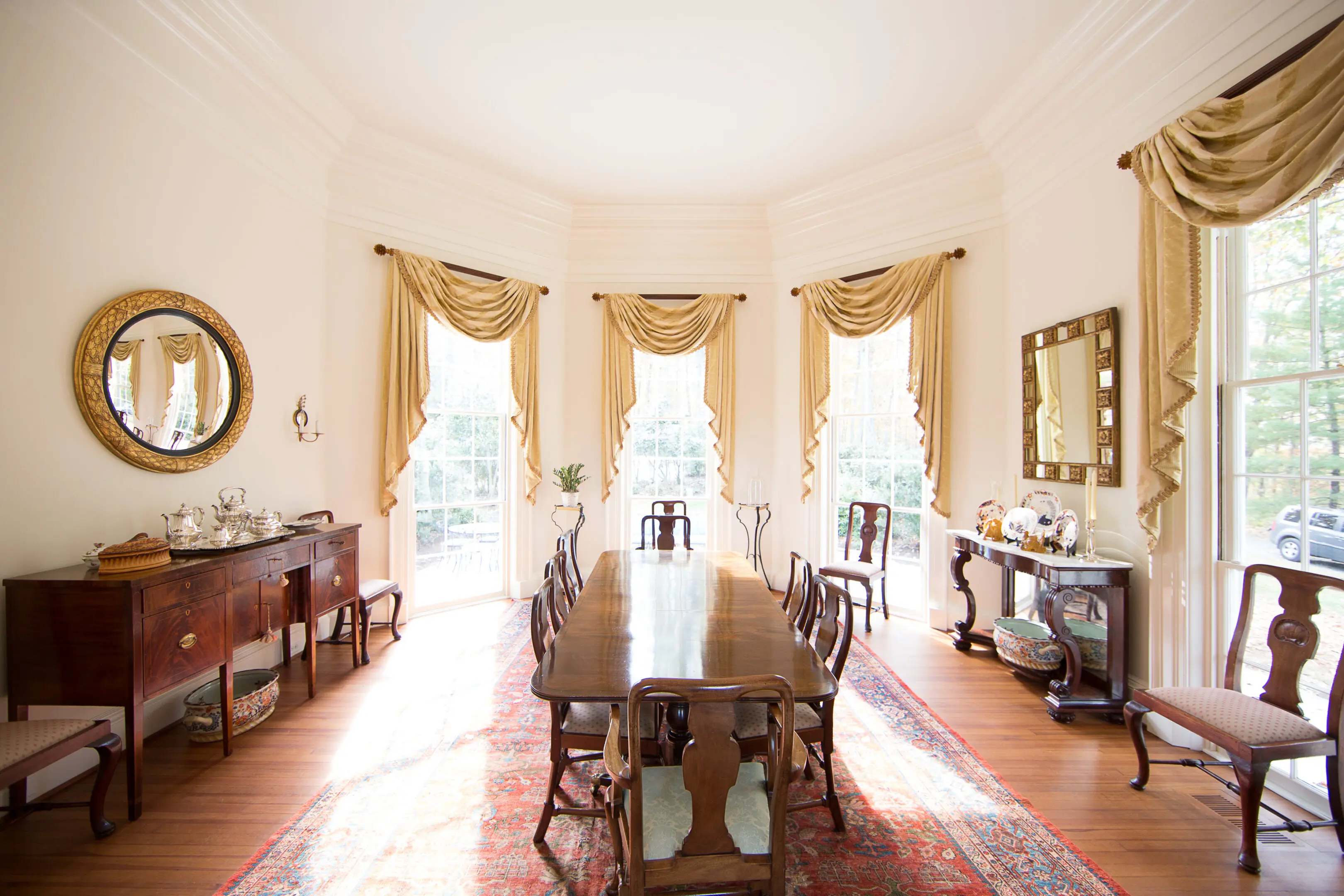 A dining room with many windows and tables