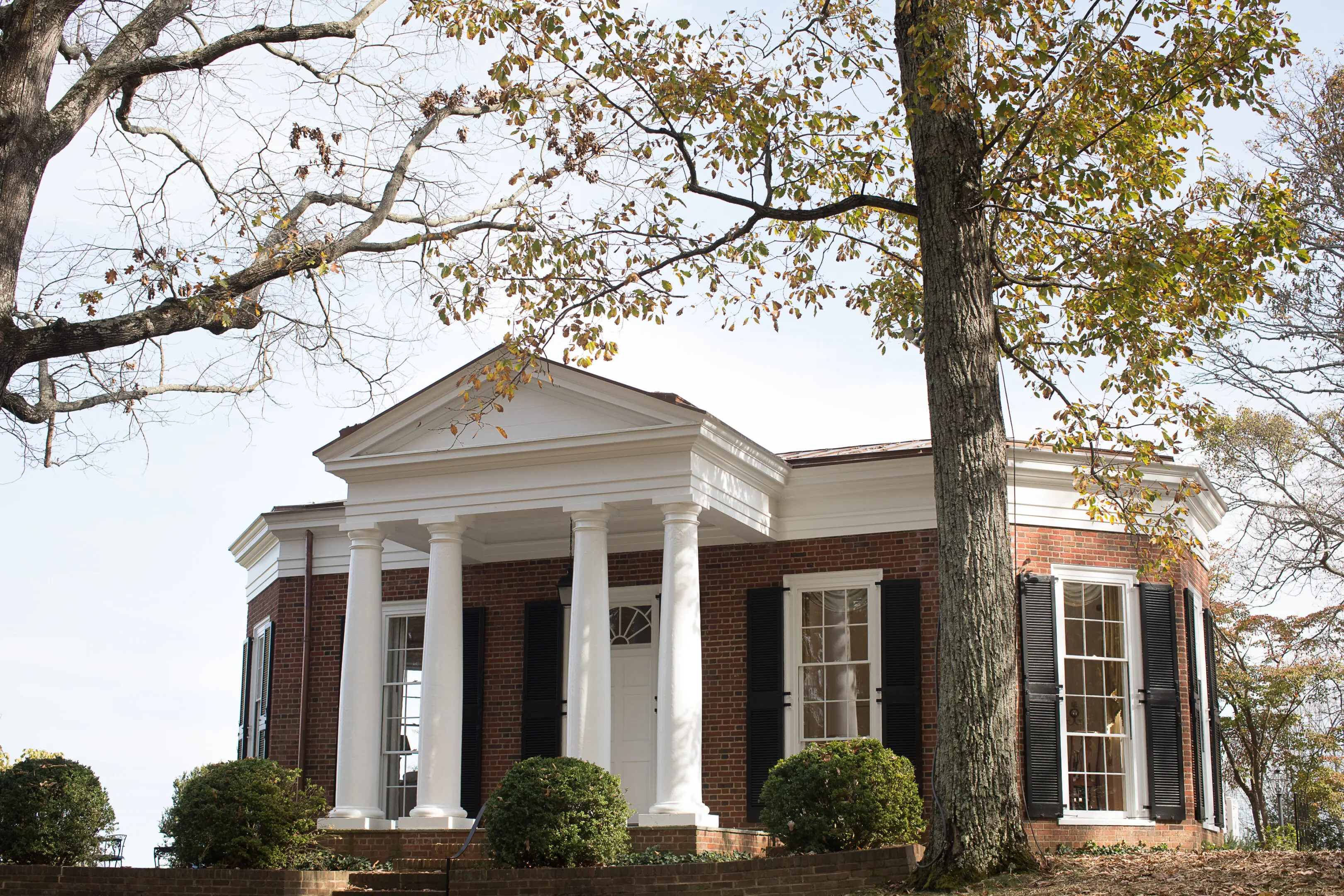 A large white building with columns and windows.