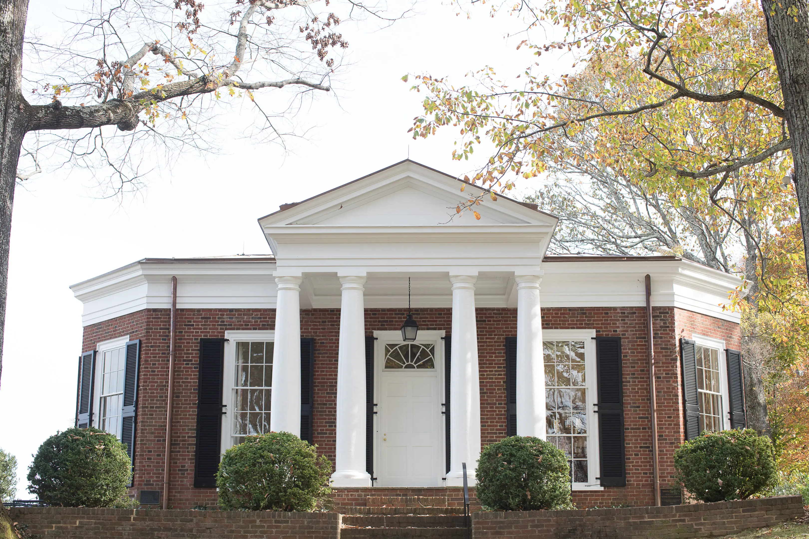 A large white building with columns and windows.